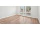 Bright bedroom with wood-look floors, neutral walls, and large windows with backyard view at 3080 Hamilton Rd, Decatur, GA 30032