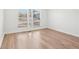 Bright bedroom with wood-look floors, neutral walls, and large windows at 3080 Hamilton Rd, Decatur, GA 30032