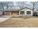 Charming bungalow-style home with white painted brick, attached garage, and a well-manicured front lawn at 3080 Hamilton Rd, Decatur, GA 30032