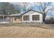 Charming bungalow-style home with painted white brick and attached garage at 3080 Hamilton Rd, Decatur, GA 30032