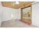 Spacious garage with tile floors, a wooden ceiling, and a glass garage door to the kitchen at 3080 Hamilton Rd, Decatur, GA 30032