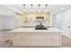 Bright kitchen features new cabinets, stainless appliances, and a large center island with a white countertop at 3080 Hamilton Rd, Decatur, GA 30032