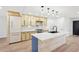 Bright kitchen features new cabinets, stainless appliances, and a large center island with a white countertop at 3080 Hamilton Rd, Decatur, GA 30032