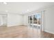 Bright living room boasts natural light from sliding glass doors to deck and modern flooring at 3080 Hamilton Rd, Decatur, GA 30032