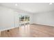 Bright living room boasts natural light from sliding glass doors to deck and modern flooring at 3080 Hamilton Rd, Decatur, GA 30032