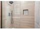 Modern shower featuring sleek fixtures, glass partition, and tiled walls at 3080 Hamilton Rd, Decatur, GA 30032
