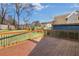 Wooden deck overlooking green backyard and the neighborhood at 1986 Memorial Se Dr, Atlanta, GA 30317