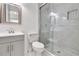 Remodeled bathroom showcasing a glass shower, modern fixtures, and white tiling at 1986 Memorial Se Dr, Atlanta, GA 30317