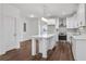 Modern kitchen with white cabinets, stainless steel appliances, and a large island, ideal for cooking and entertaining at 1986 Memorial Se Dr, Atlanta, GA 30317