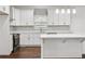 Stylish kitchen with white cabinetry, stainless steel appliances, and a center island with counter seating at 1986 Memorial Se Dr, Atlanta, GA 30317