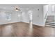 Inviting living room with hardwood floors, a staircase, and a view of the front door at 1986 Memorial Se Dr, Atlanta, GA 30317