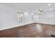 Bright living room with hardwood floors, featuring large windows and a view of the front entry at 1986 Memorial Se Dr, Atlanta, GA 30317