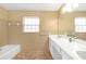 Bathroom with tile flooring, spacious mirror, and a window for natural light at 2329 Crestknoll Cir, Decatur, GA 30032