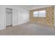 Bedroom with natural lighting, and floral wallpaper, closet for ample storage at 2329 Crestknoll Cir, Decatur, GA 30032