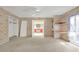Bedroom features floral wallpaper, window with natural light, and an open doorway at 2329 Crestknoll Cir, Decatur, GA 30032