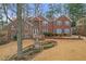Charming brick home with manicured front yard and inviting water feature at 2329 Crestknoll Cir, Decatur, GA 30032