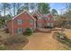 Stately brick residence boasts mature landscaping and elegant curb appeal at 2329 Crestknoll Cir, Decatur, GA 30032