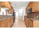Well-lit kitchen features granite countertops, wood cabinets, and tiled flooring at 2329 Crestknoll Cir, Decatur, GA 30032