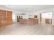 Open living area featuring a brick bar, built-in shelving, and tiled floors at 2329 Crestknoll Cir, Decatur, GA 30032