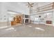 Open-concept living room with high ceilings, brick fireplace, and lots of natural light at 2329 Crestknoll Cir, Decatur, GA 30032