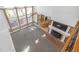 Aerial view of an open-concept living area with tall windows and a brick fireplace at 2329 Crestknoll Cir, Decatur, GA 30032