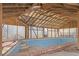 Indoor pool with a wood beam ceiling and walls at 2329 Crestknoll Cir, Decatur, GA 30032