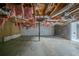 The unfinished basement has exposed pipes at 3500 Quail Hollow Trl, Snellville, GA 30039