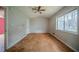 Spacious bedroom with a large window and plywood flooring at 3500 Quail Hollow Trl, Snellville, GA 30039