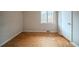 Empty bedroom with hardwood floors, a window, and a closet at 3500 Quail Hollow Trl, Snellville, GA 30039