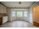 Dining room with a bay window and laminate flooring at 3500 Quail Hollow Trl, Snellville, GA 30039