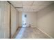 A simple laundry room features marble tile floors and white painted walls at 3500 Quail Hollow Trl, Snellville, GA 30039