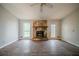 Living room featuring a stone fireplace, laminate flooring, and neutral paint at 3500 Quail Hollow Trl, Snellville, GA 30039