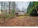 A spacious backyard with a wooden deck, perfect for outdoor entertaining and relaxation at 4570 Thicket Trl, Snellville, GA 30039