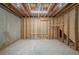 Unfinished basement with exposed framing and concrete floor, offering room for customization at 4570 Thicket Trl, Snellville, GA 30039