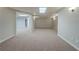 Finished basement space with neutral carpet and open floor plan ready for customization at 4570 Thicket Trl, Snellville, GA 30039