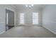 Dining room with carpet floors and ample natural light at 4570 Thicket Trl, Snellville, GA 30039