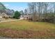 Charming two-story home with a brick facade, landscaped yard, and driveway at 4570 Thicket Trl, Snellville, GA 30039