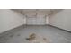 This spacious garage features a concrete floor and ample parking for vehicles at 4570 Thicket Trl, Snellville, GA 30039