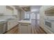 Bright kitchen with an island cooktop, stainless appliances, and a view of the breakfast area at 4570 Thicket Trl, Snellville, GA 30039