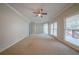 Bright, airy living room with a ceiling fan and access to the outdoor deck at 4570 Thicket Trl, Snellville, GA 30039