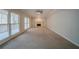 Spacious living room featuring a fireplace and large windows, inviting natural light at 4570 Thicket Trl, Snellville, GA 30039