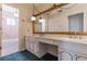 Bathroom featuring dual sinks, ample counter space, and well-lit vanity at 2 Westchester Sq, Decatur, GA 30030