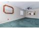 Spacious bedroom with a ceiling fan, two mirrors, and a window with plantation shutters at 2 Westchester Sq, Decatur, GA 30030