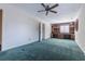 Bedroom with a ceiling fan and built-in bookshelves featuring a window with plantation shutters at 2 Westchester Sq, Decatur, GA 30030