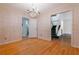 Dining area with hardwood flooring, elegant chandelier, and decorative wallpaper with staircase access at 2 Westchester Sq, Decatur, GA 30030