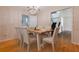 Elegant dining room with chandelier lighting and seating for six at 2 Westchester Sq, Decatur, GA 30030