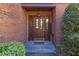 Inviting front entrance with a decorative glass door and brick surround at 2 Westchester Sq, Decatur, GA 30030