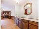 Hallway with wood floors and built-in cabinets leading to the living room with fireplace at 2 Westchester Sq, Decatur, GA 30030