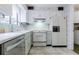 Kitchen with white appliances, countertops, and a view of backyard at 2 Westchester Sq, Decatur, GA 30030