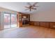 Inviting living room with hardwood floors, a brick fireplace, custom shelving, and a sliding glass door at 2 Westchester Sq, Decatur, GA 30030